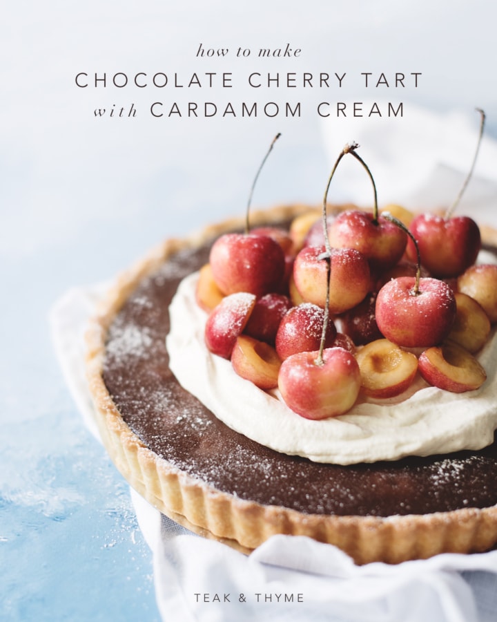 Chocolate cherry tart with cardamom cream on blue background
