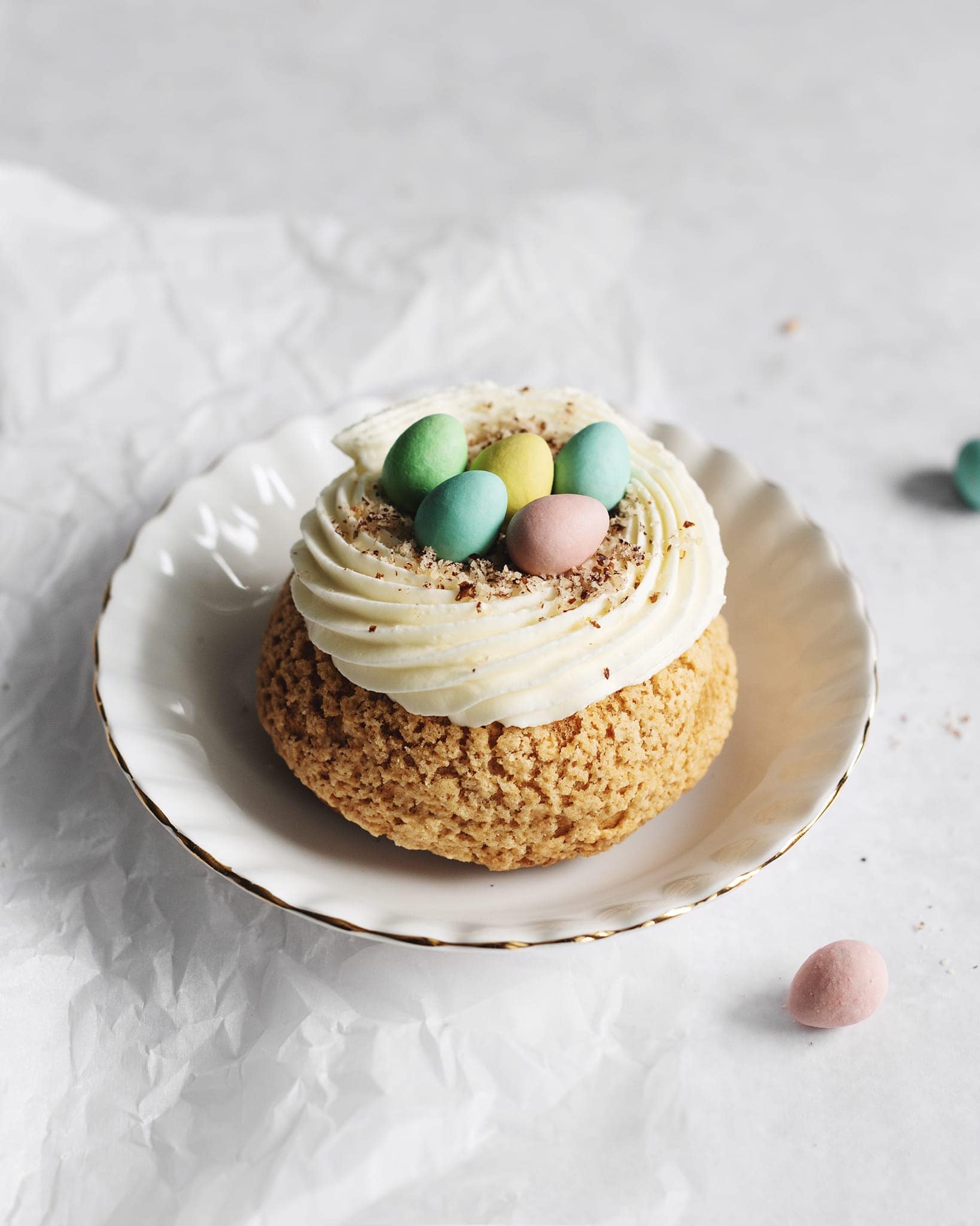 One mini egg cream puff on a plate
