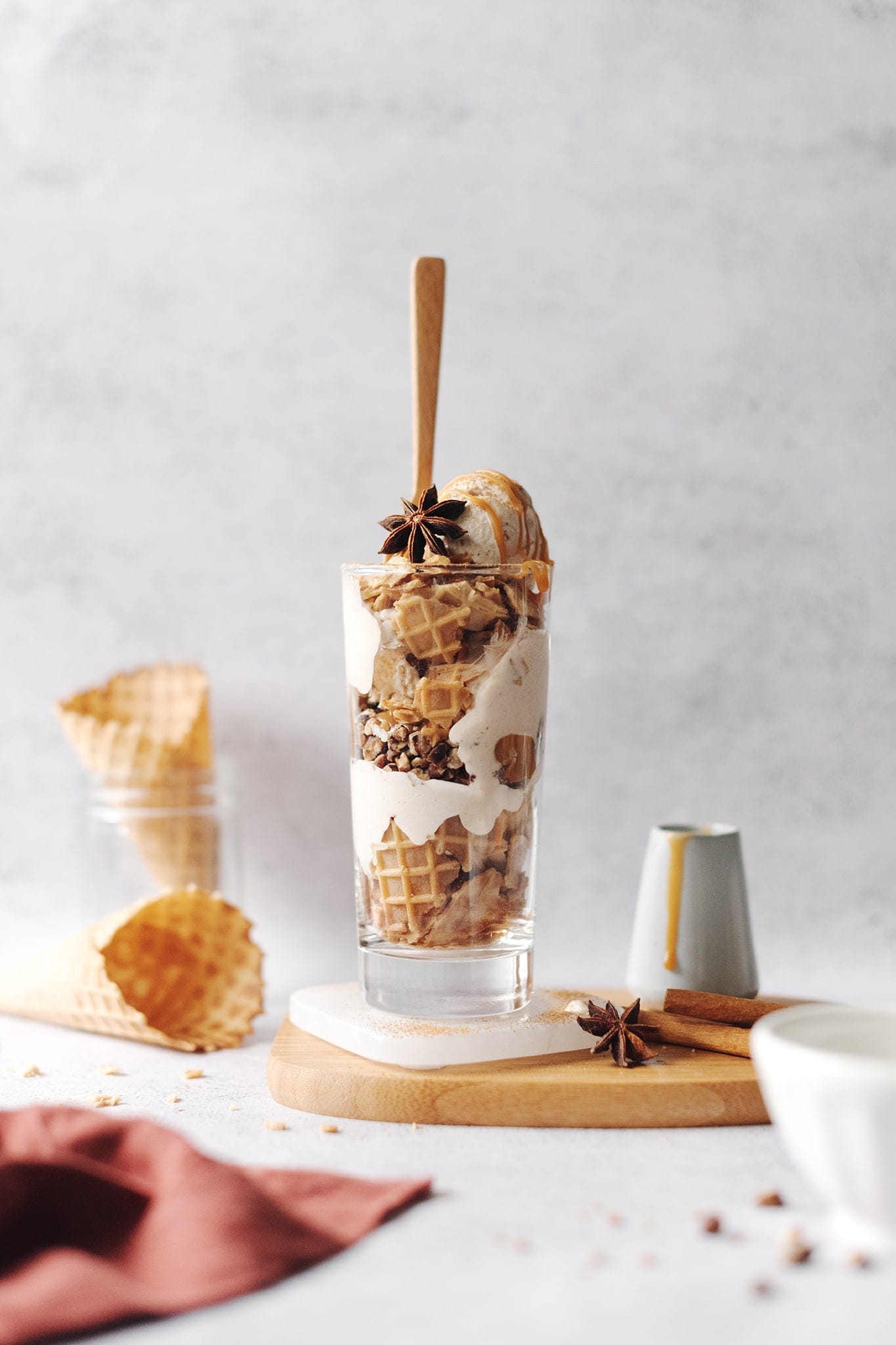 Chai spiced ice cream parfait layers in a tall glass