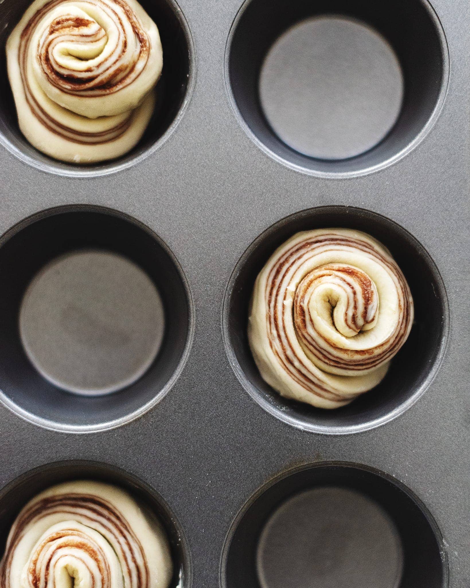 Unbaked nutella cruffins in muffin pan
