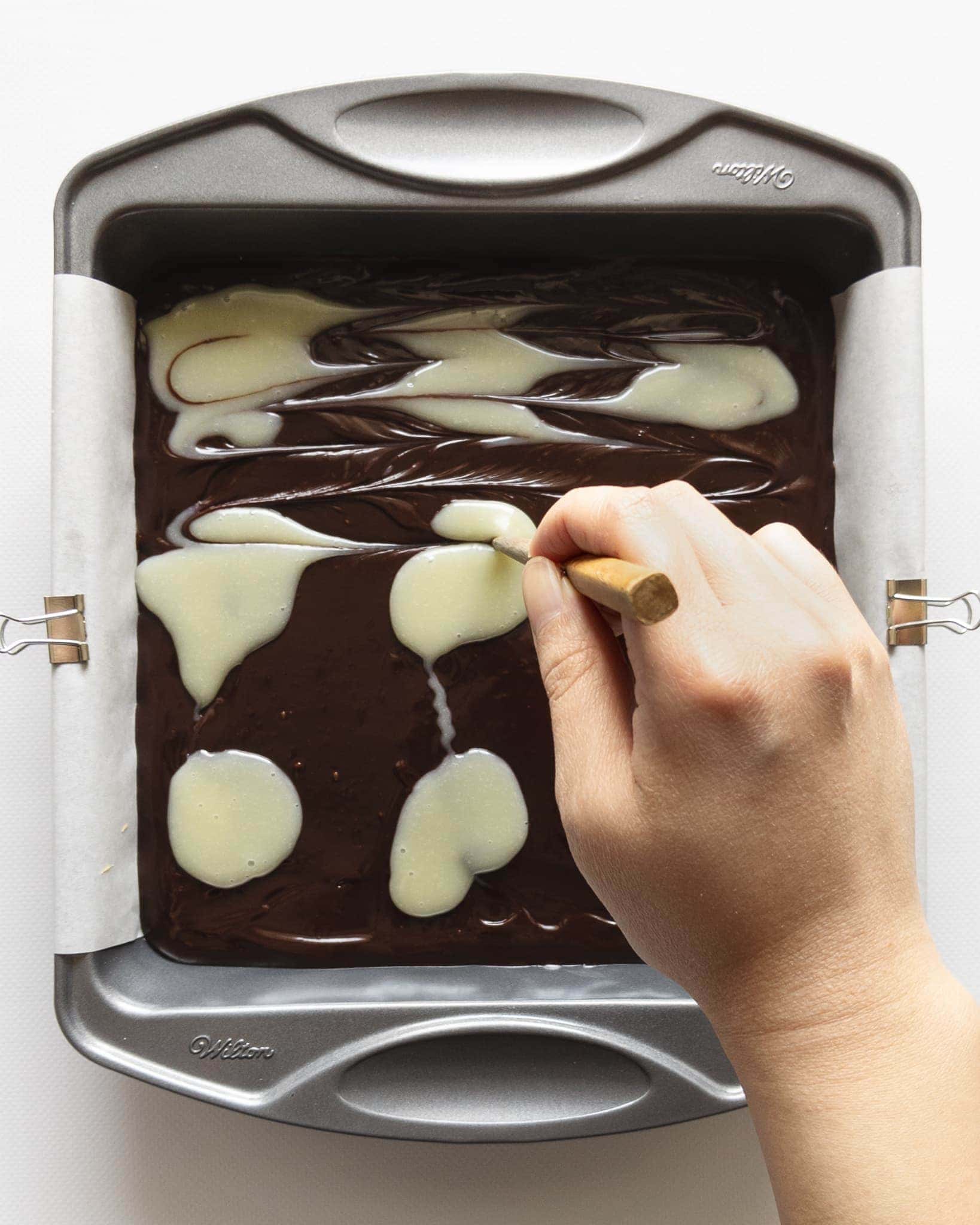 Marbling chocolate ganache pattern with chopstick