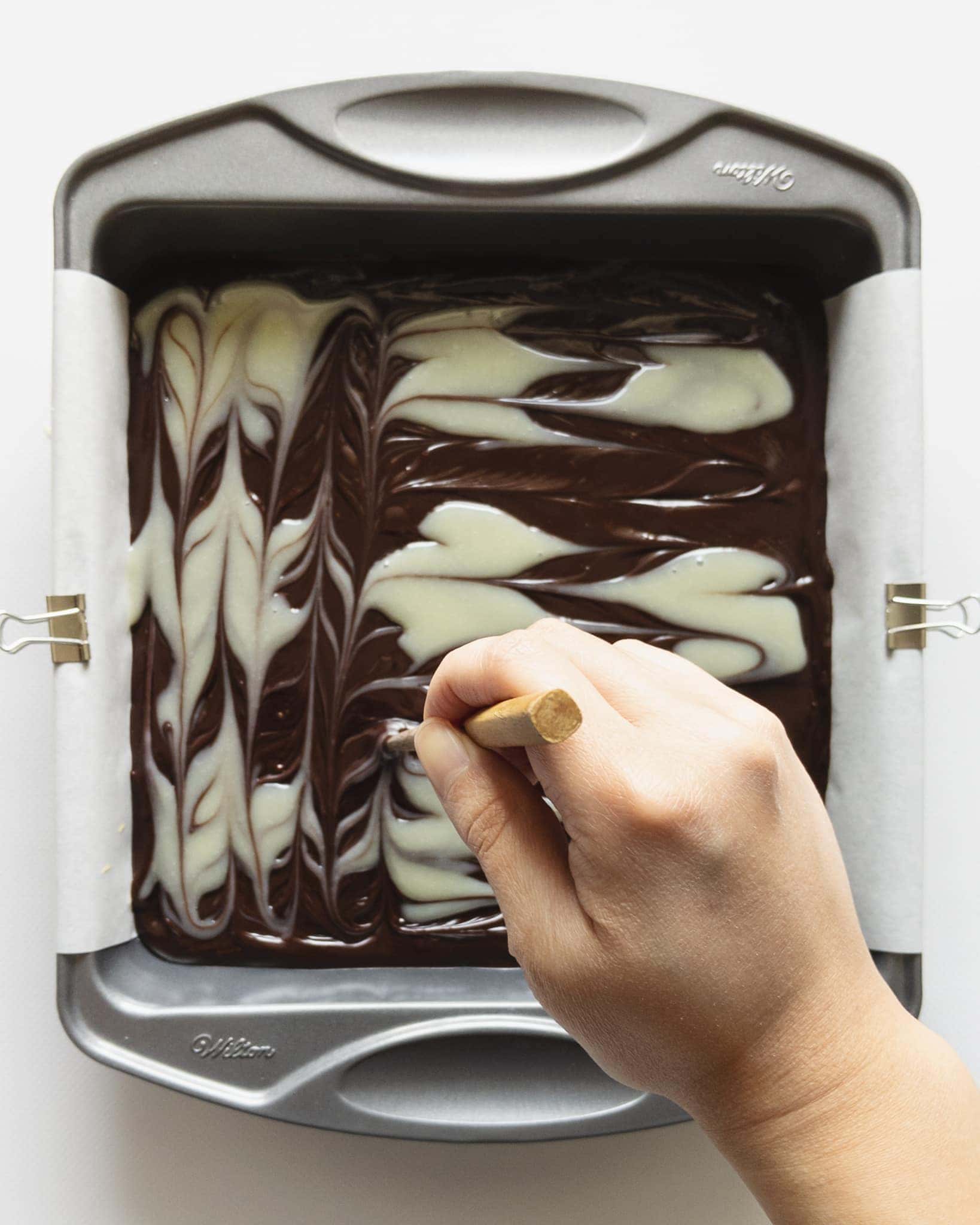 Marbling chocolate ganache pattern with chopstick