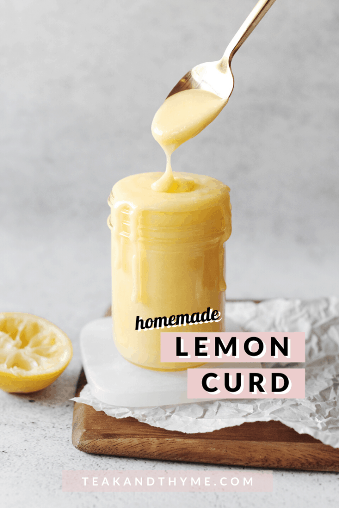 Spoon dripping lemon curd into glass jar