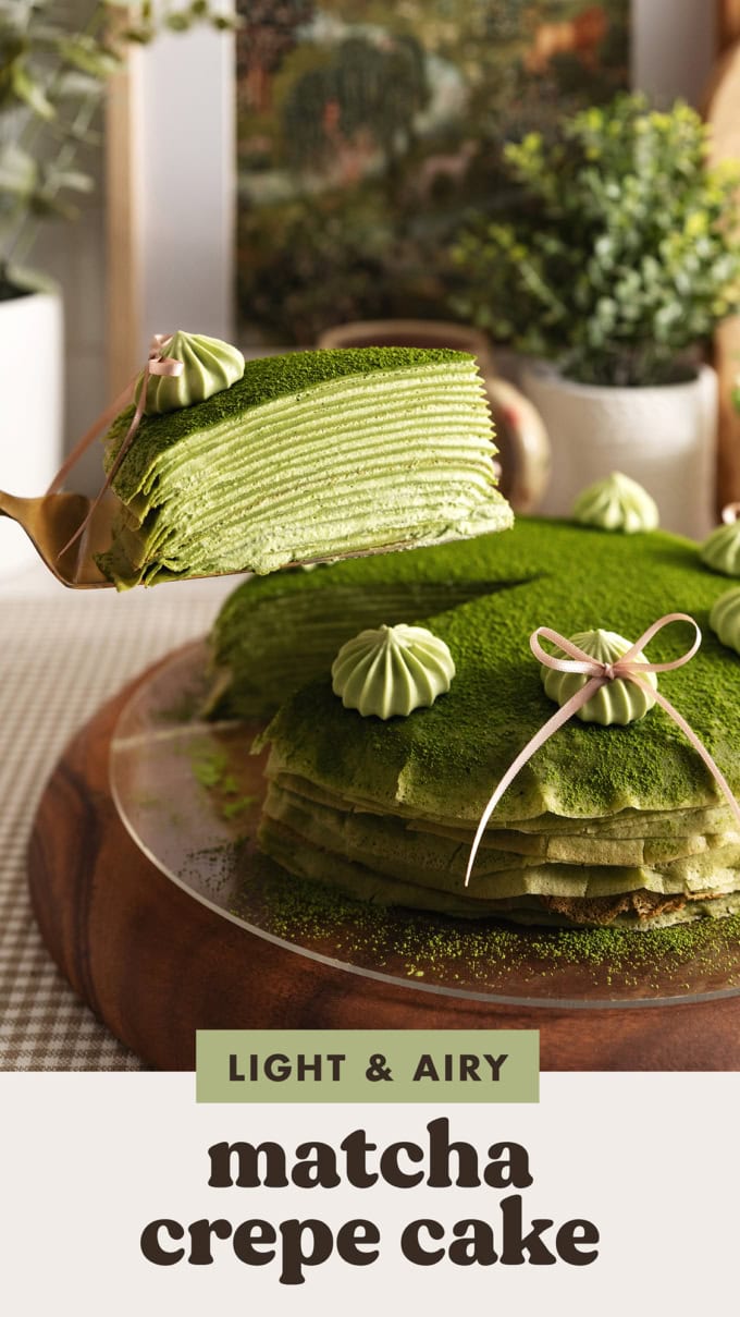 A slice of matcha crepe cake lifted above the rest of the cake to show the many layers.