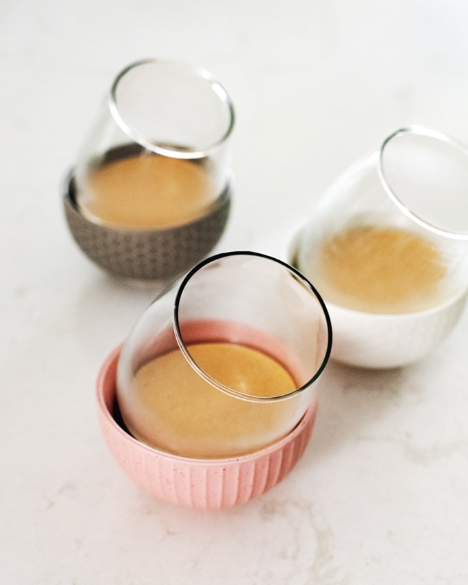 Glasses tilted at an angle in bowls