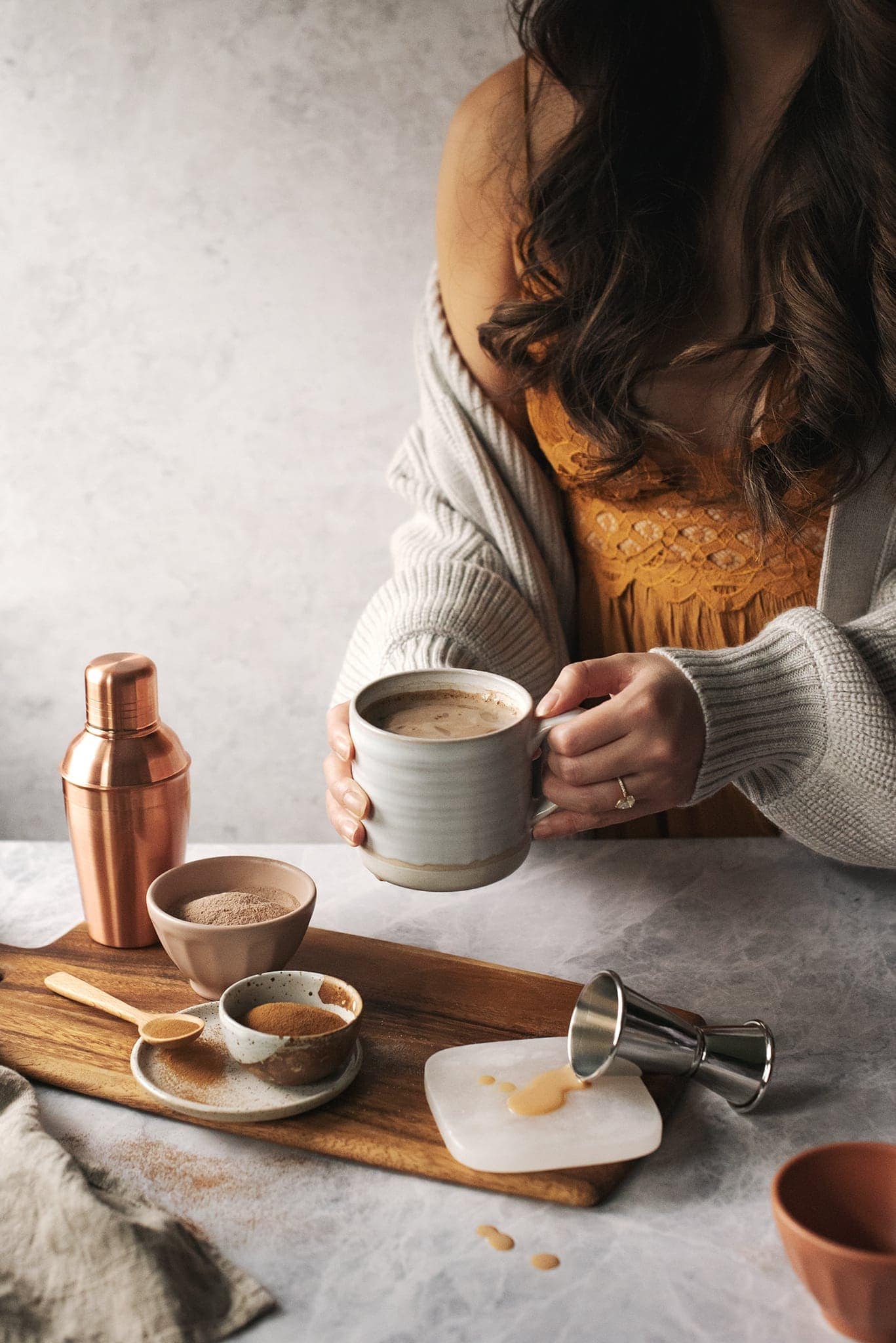Hands holding a mug of Amarula caffè mocha