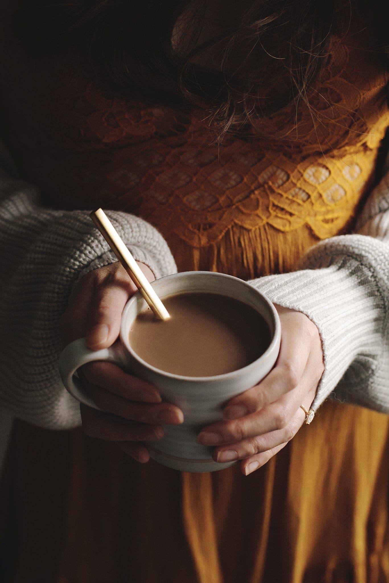 Holding a mug of Amarula caffe mocha in hands