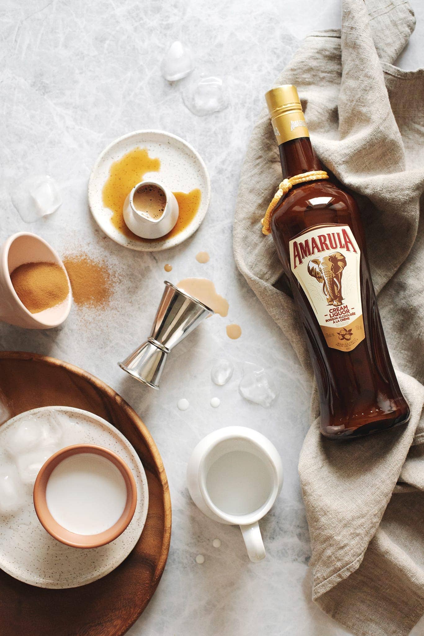 Amarula bottle and coffee spilled on table
