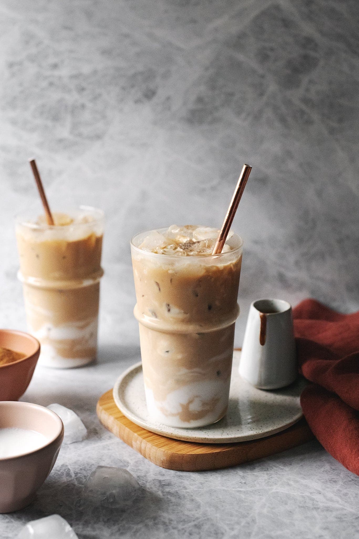 Two glasses of iced coconut Amarula latte with straws