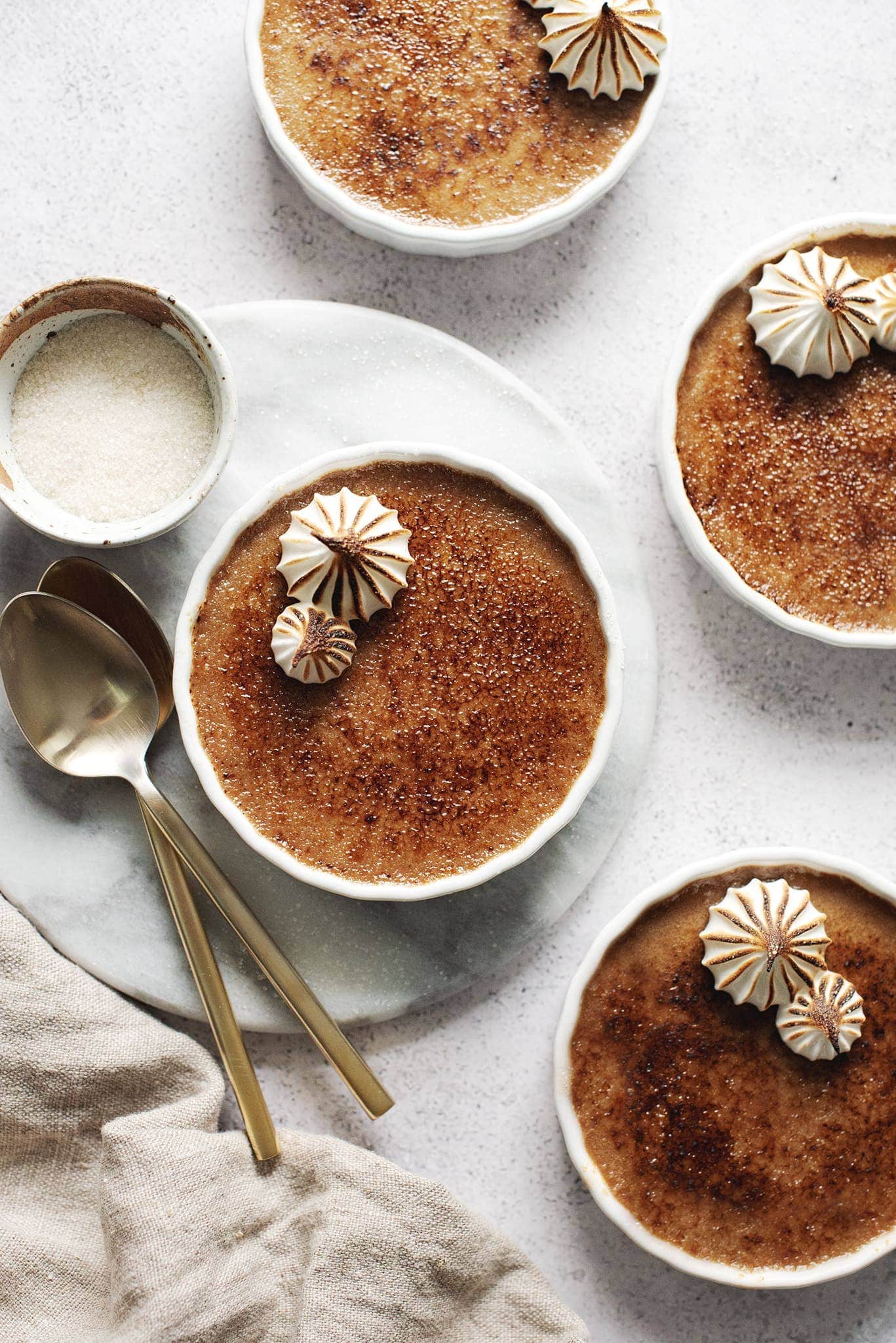 Pots of earl grey crème brûlée with torched surface