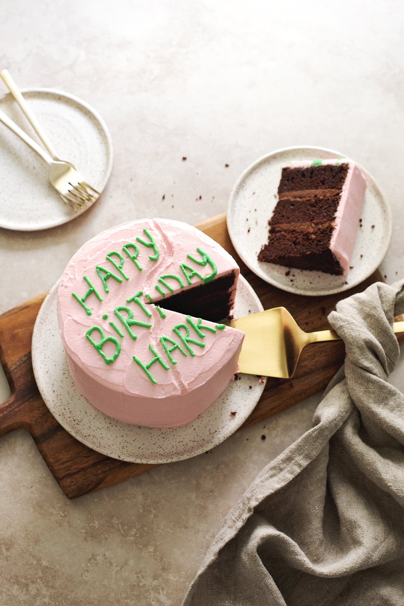 Chocolate birthday cake with slice cut out of it