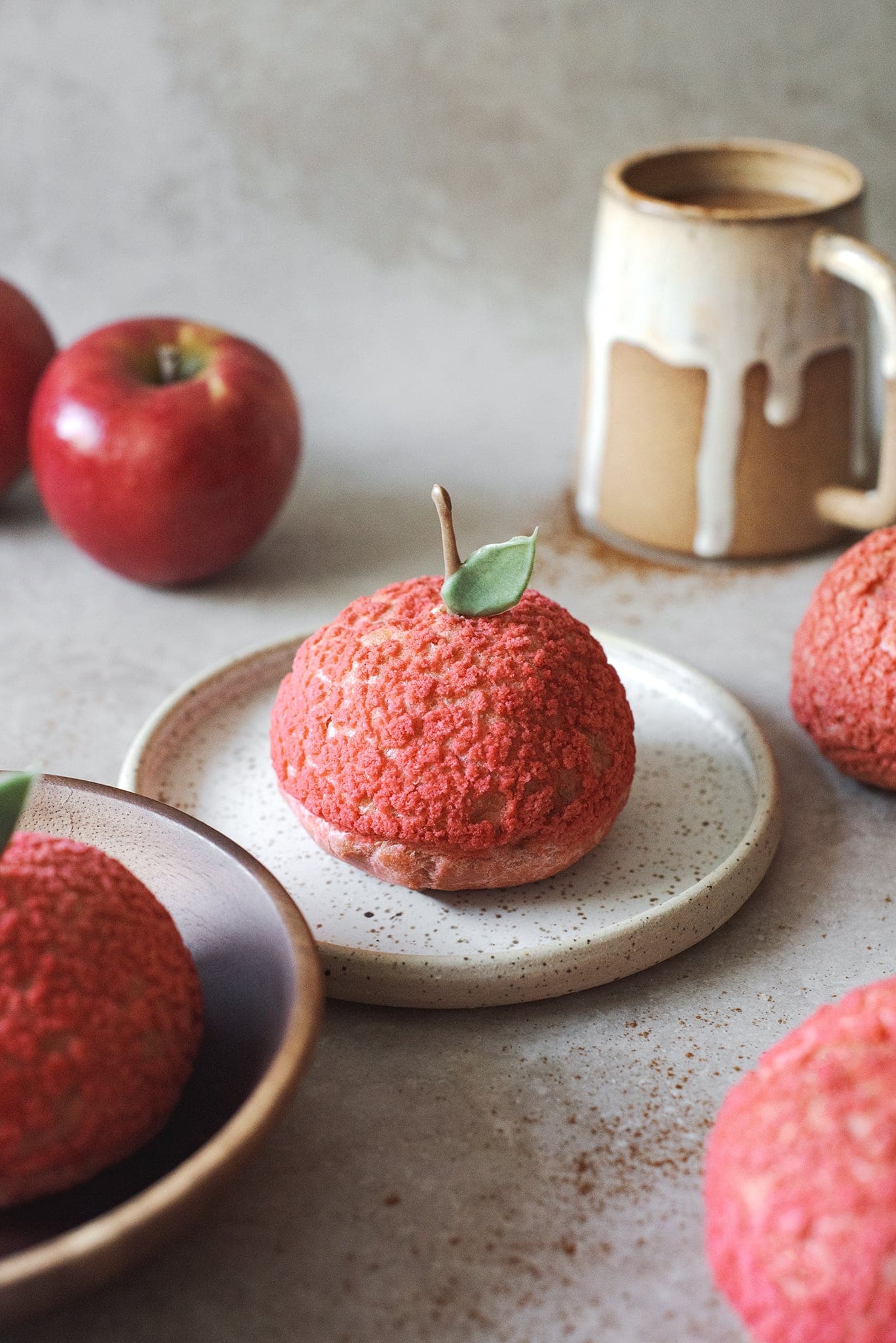 Red cinnamon apple cream puffs that look like apples