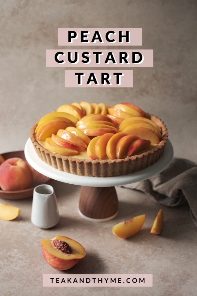 Peach custard tart on a cake stand