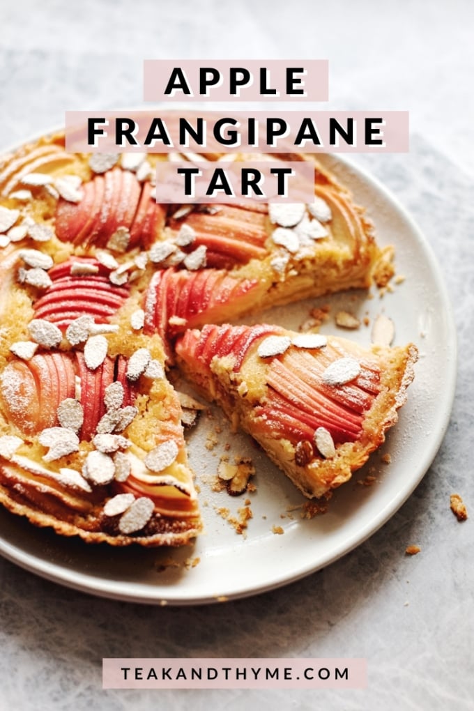 apple frangipane tart with a slice cut out of it