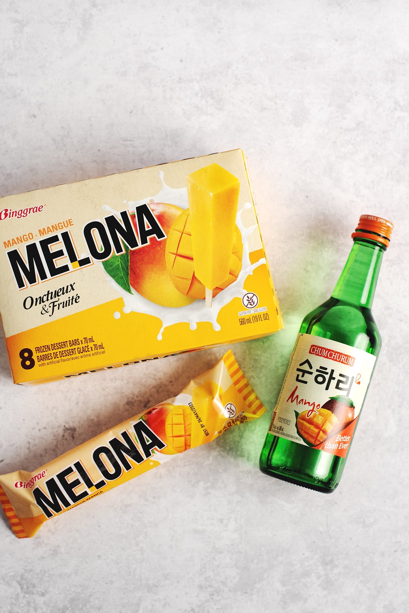 Box of mango melona bars and bottle of apple mango soju