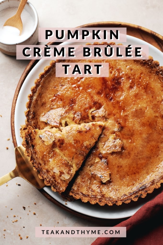 pie server lifting a slice of pumpkin crème brûlée tart from the plate