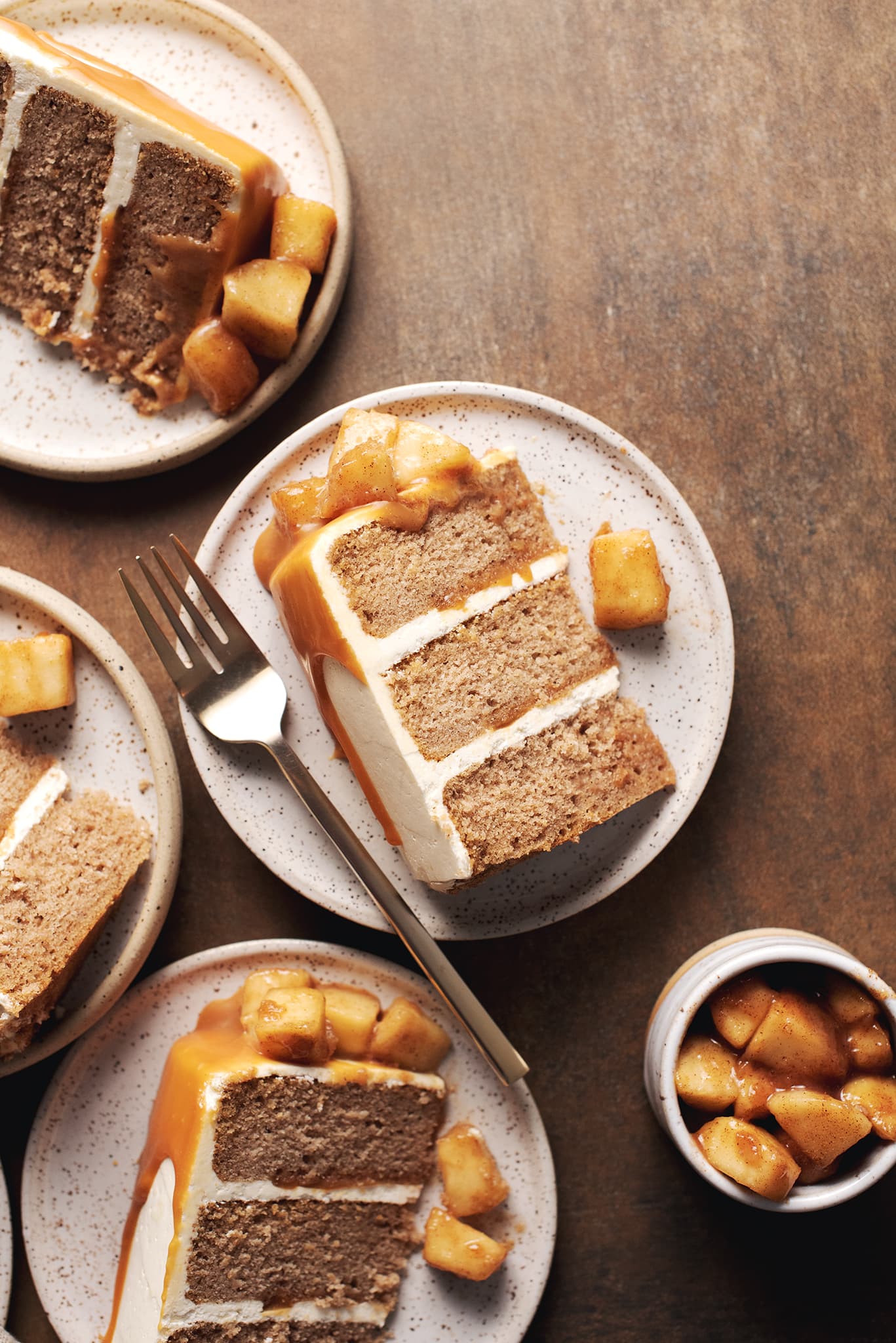 slice of caramel apple cake showing three layers on plate
