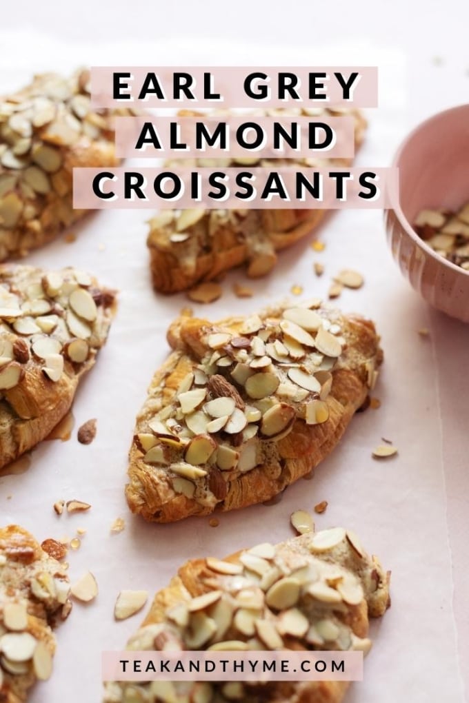 Almond croissants sprinkled with sliced almonds on pink background