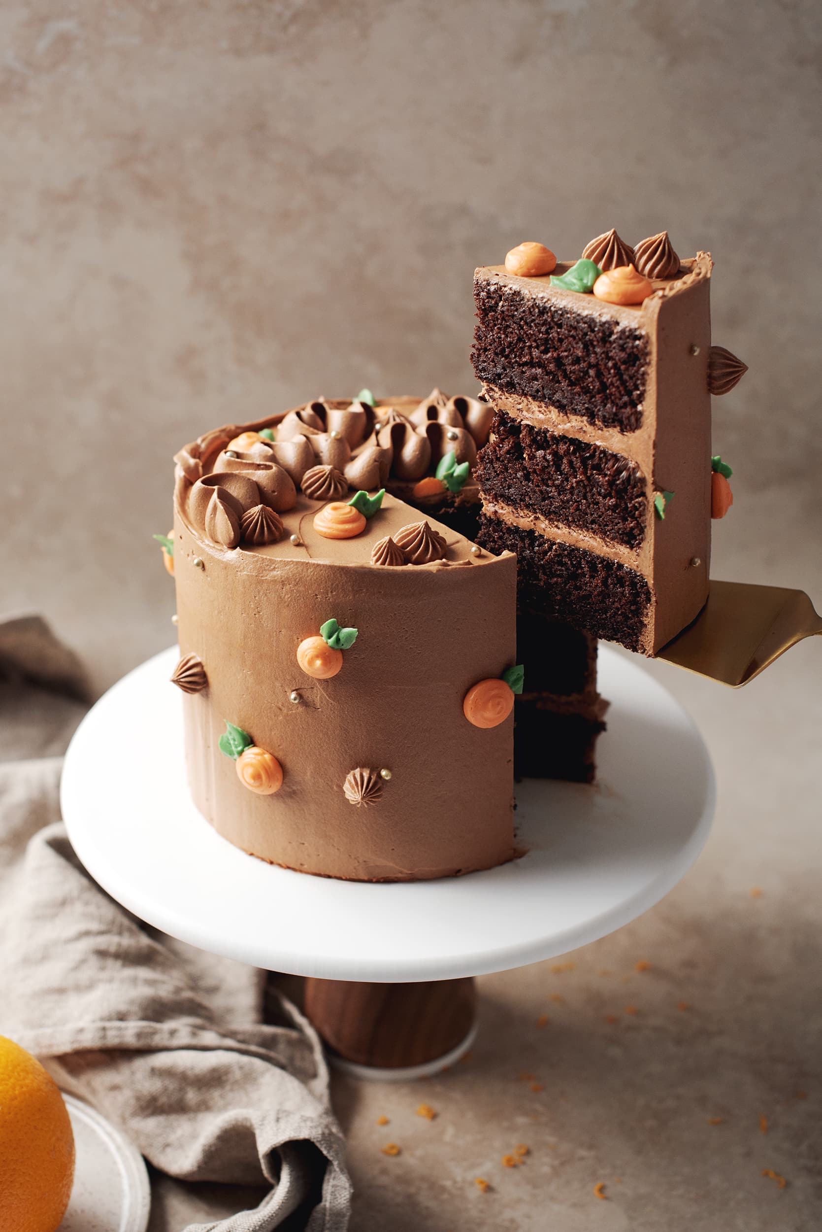 slice of chocolate orange cake lifted with cake server