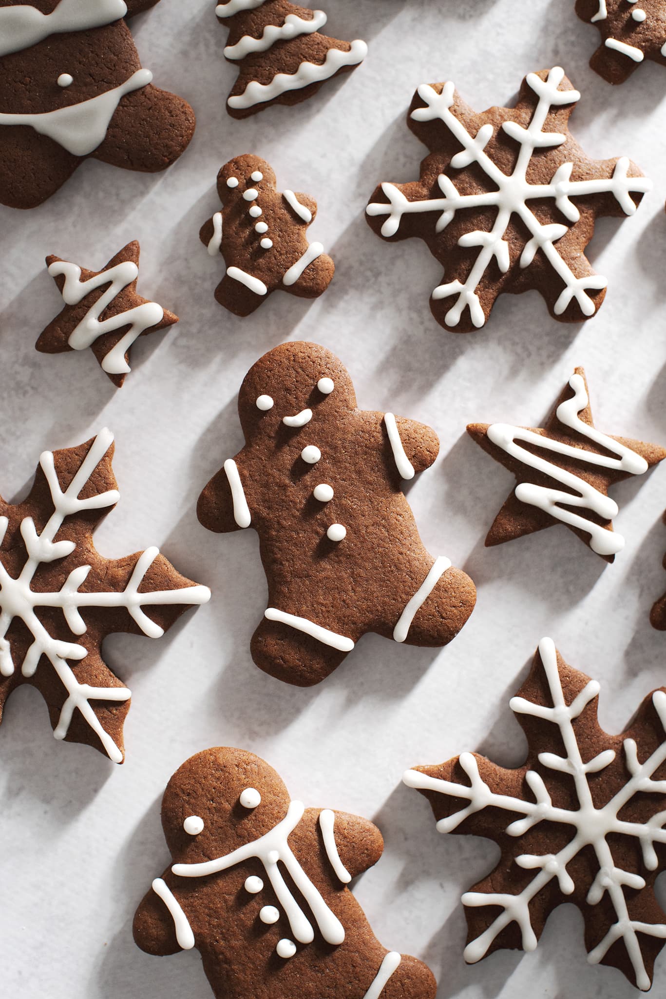 easy gingerbread cookies cut out into various shapes
