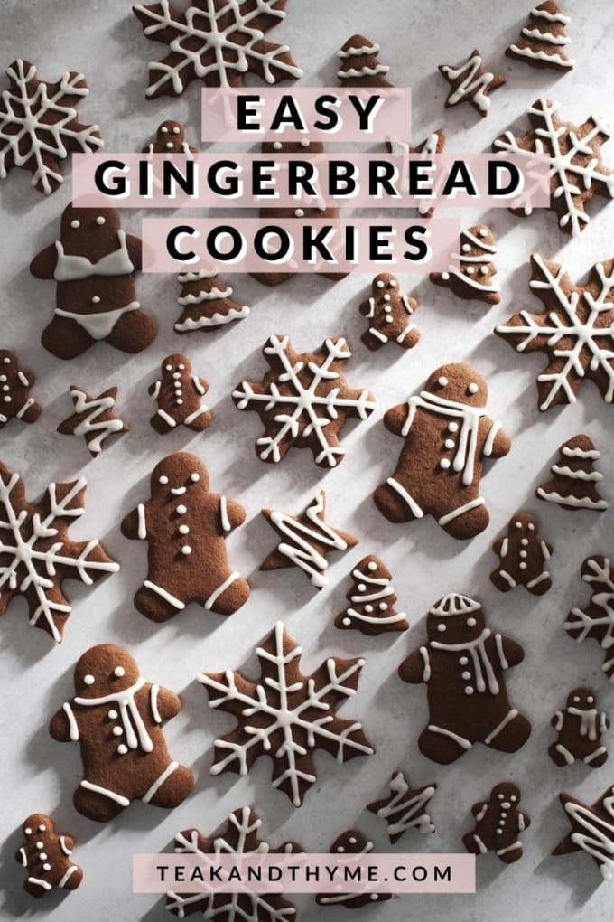 cut out gingerbread cookies scattered on grey surface