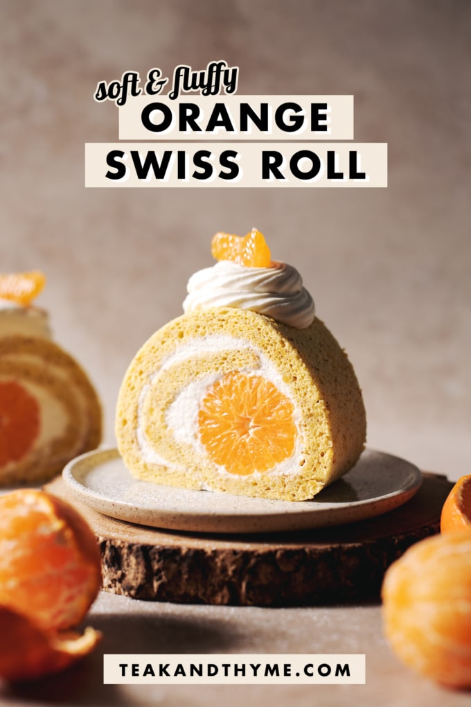 slice of orange swiss roll with mandarin orange in the middle