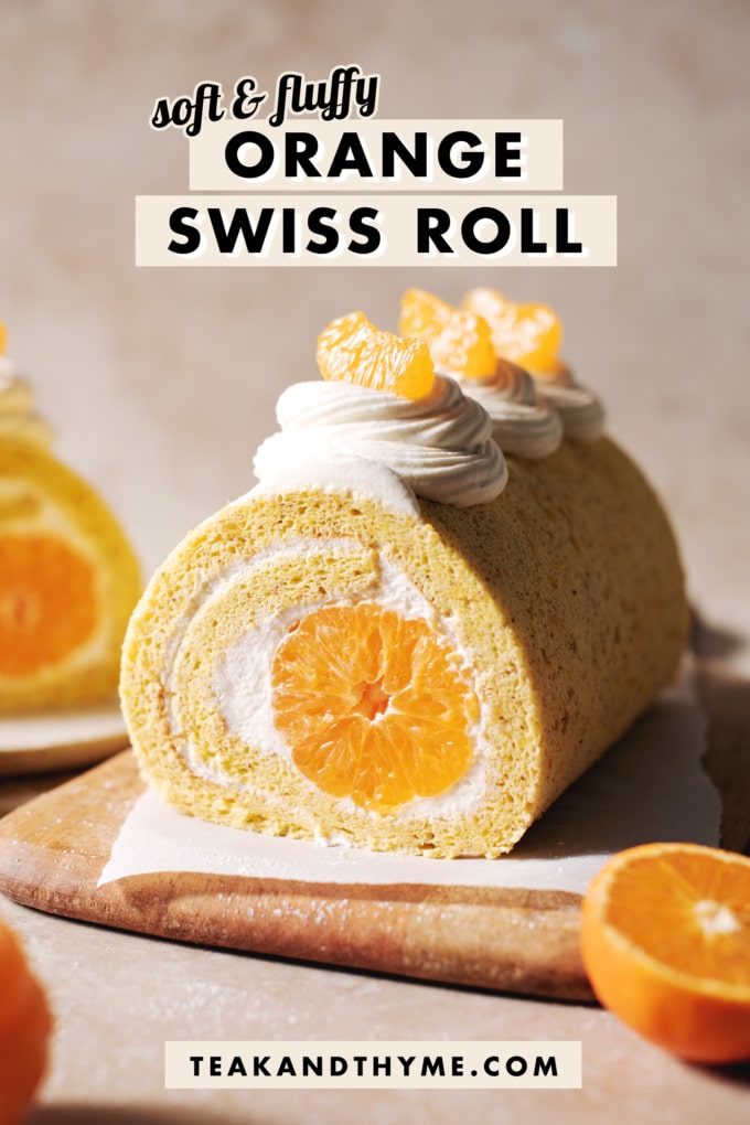 orange swiss roll cake on wooden platter