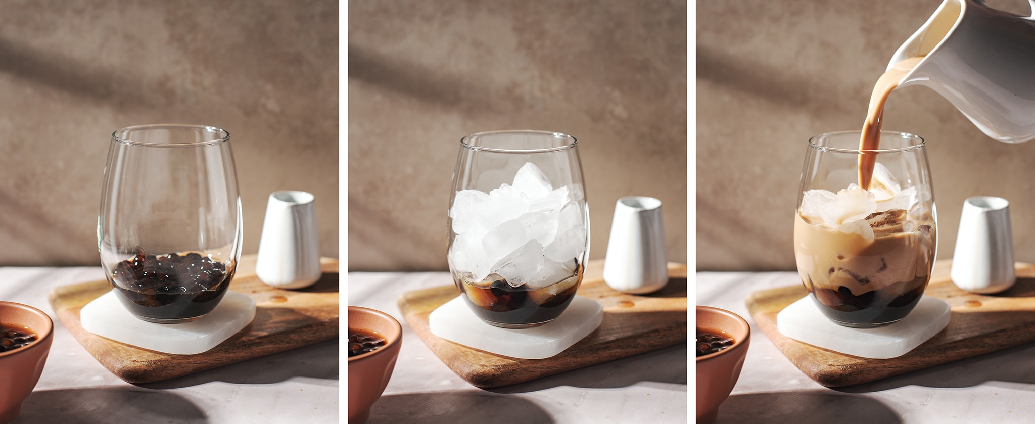 Pouring all bubble tea components into a glass.