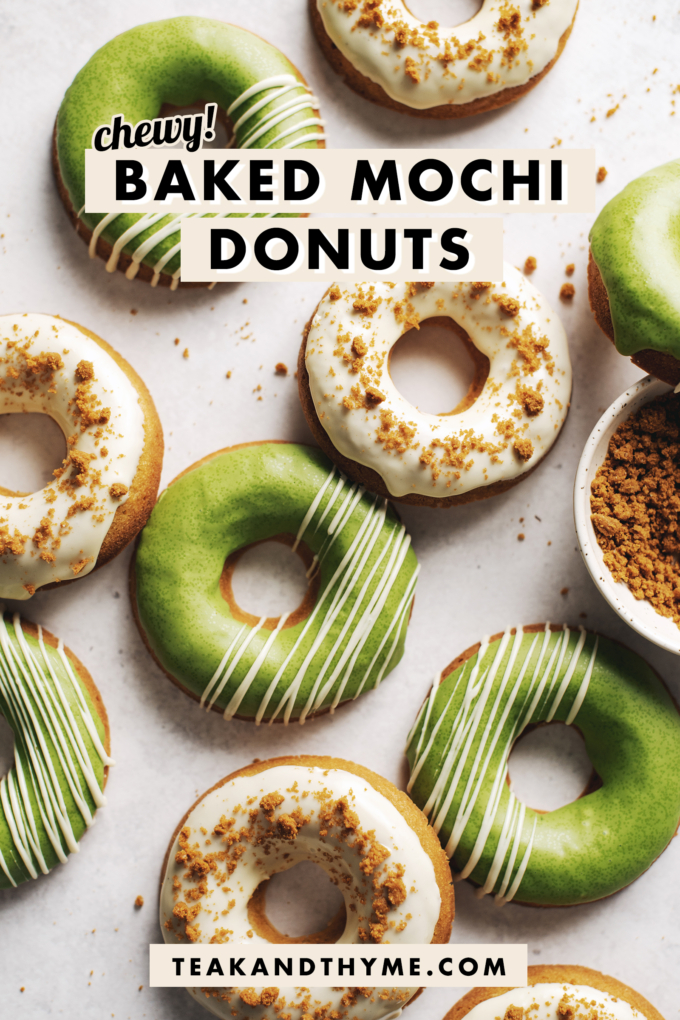 Matcha and white chocolate biscoff mochi donuts scattered on table.