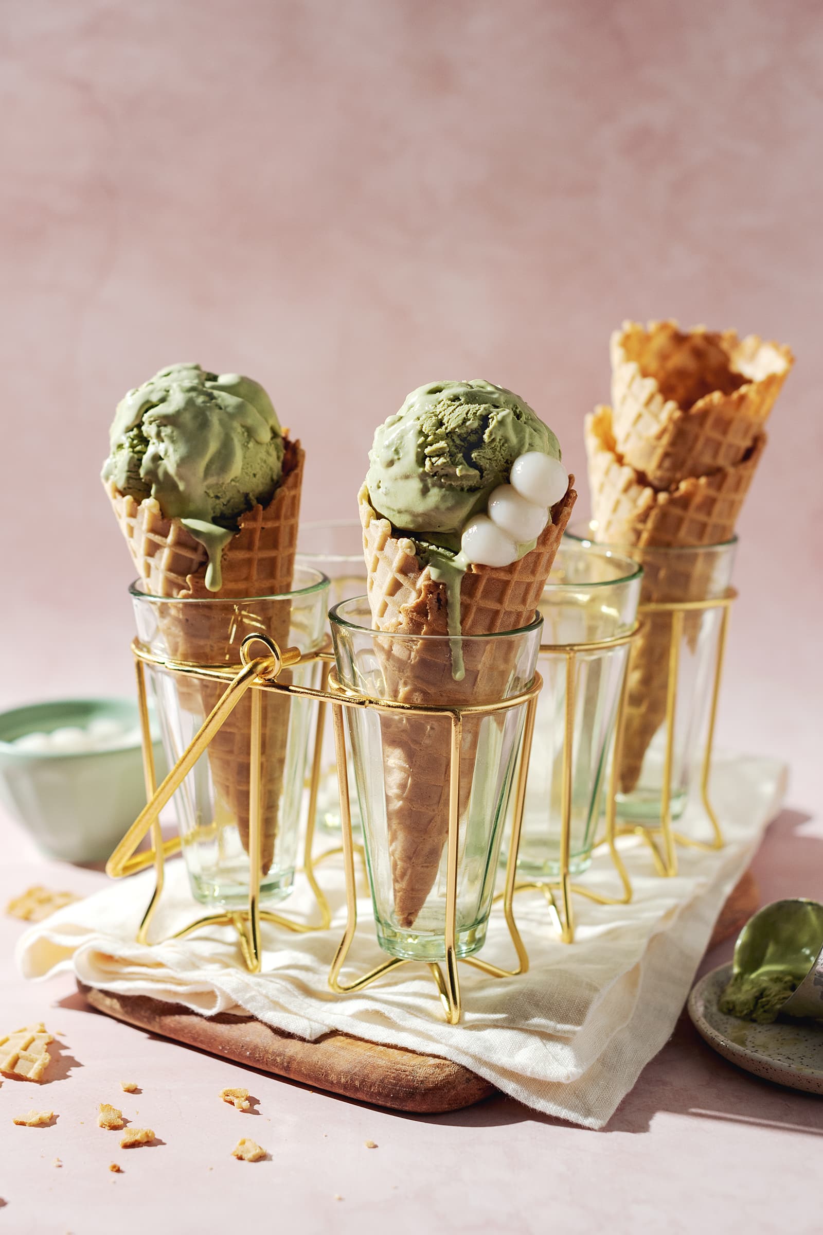 two scoops of matcha ice cream in waffle cones