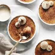 Spoonful of crème brûlée with caramelized sugar shards