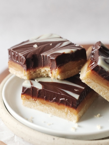 Millionaires shortbread bar with bite taken out of it