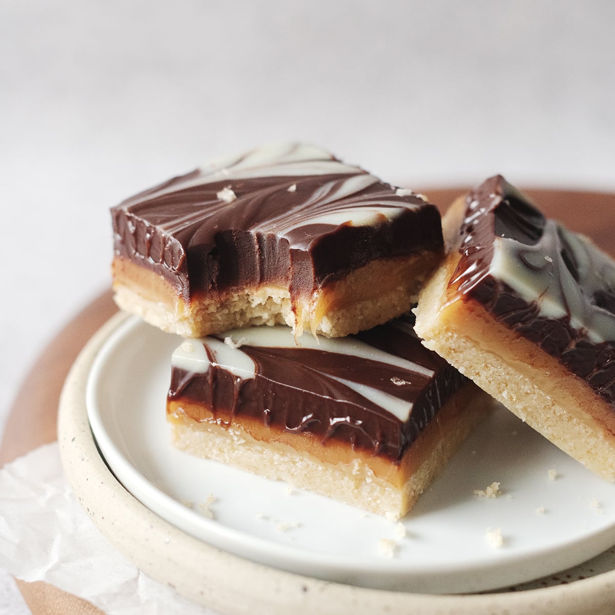 Millionaires shortbread bar with bite taken out of it