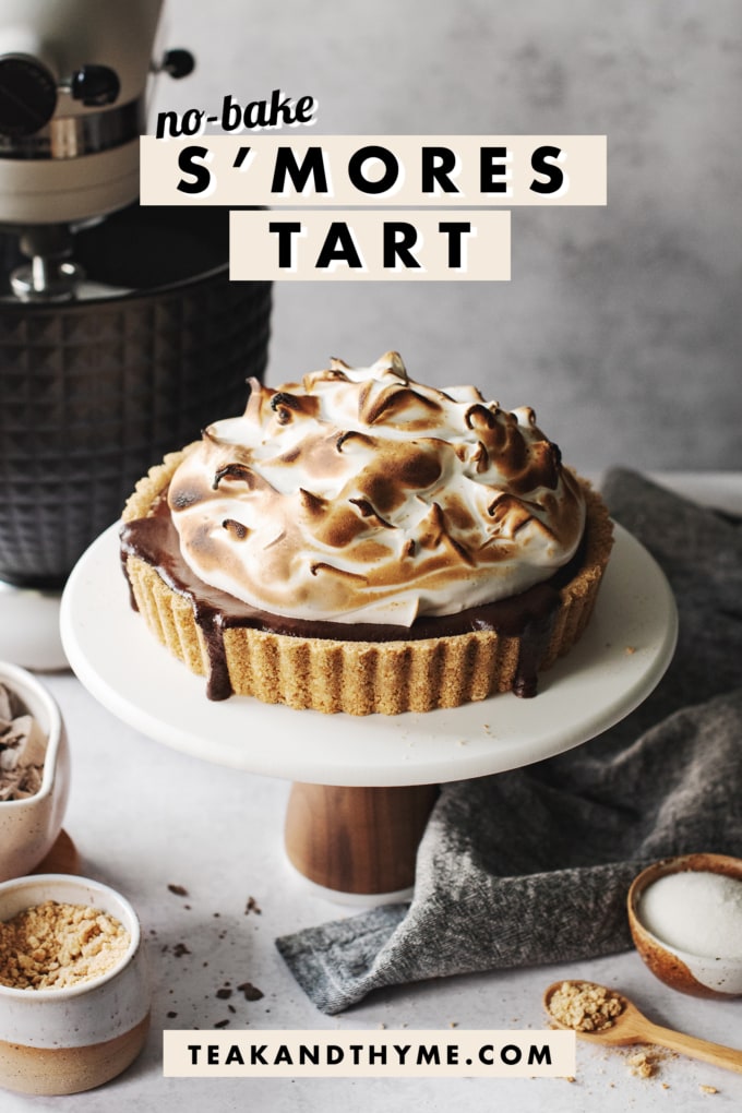 Sโmores tart on a cake stand with text overlay that says โno-bake sโmores tartโ