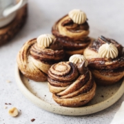 Four nutella cruffins placed on a plate on a grey background