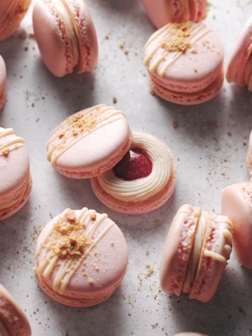 Strawberry cheesecake macaron with strawberry jam center