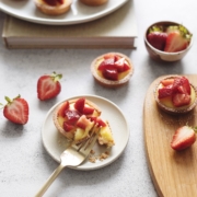 Mini lemon tartlet on plate with gold fork