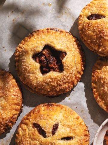 Apple hand pie with star cut out showing apple filling inside.