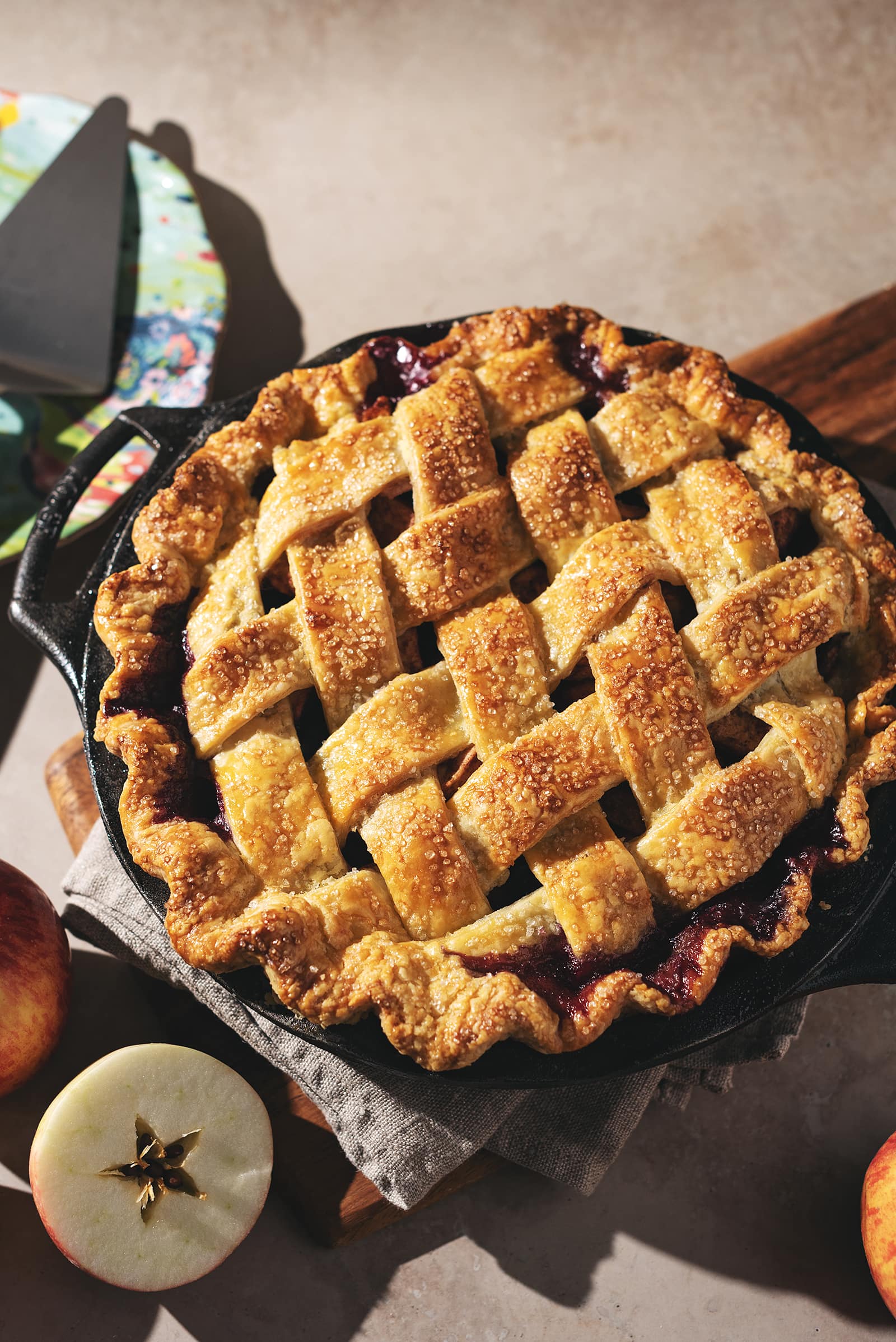 Apple pie with a golden brown woven lattice on top.