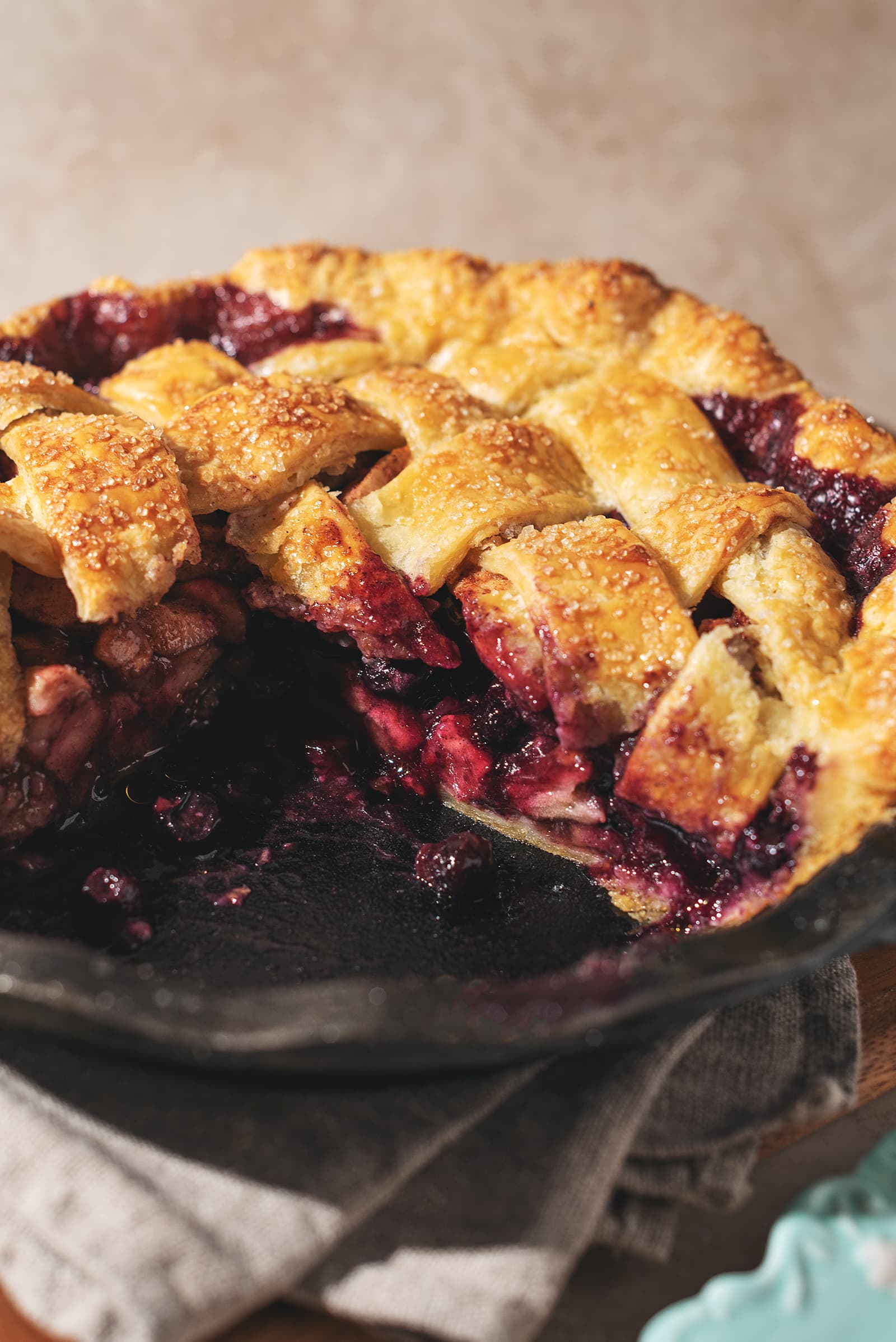 Cross section of a pie, showing the blueberry filling inside.