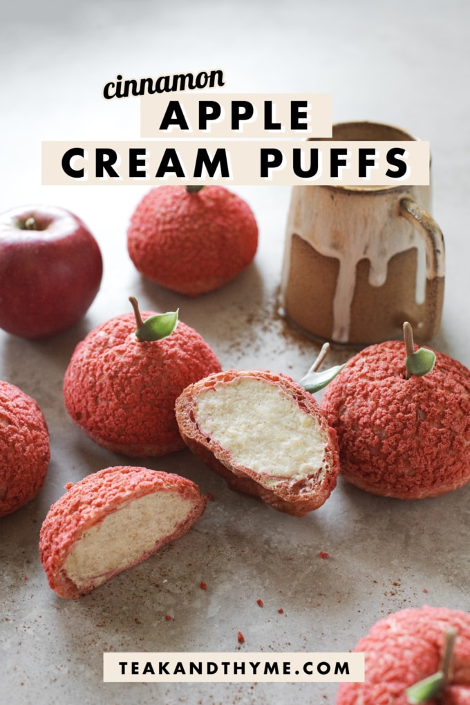 Apple cream puff cut in half to show whipped cram filling inside.