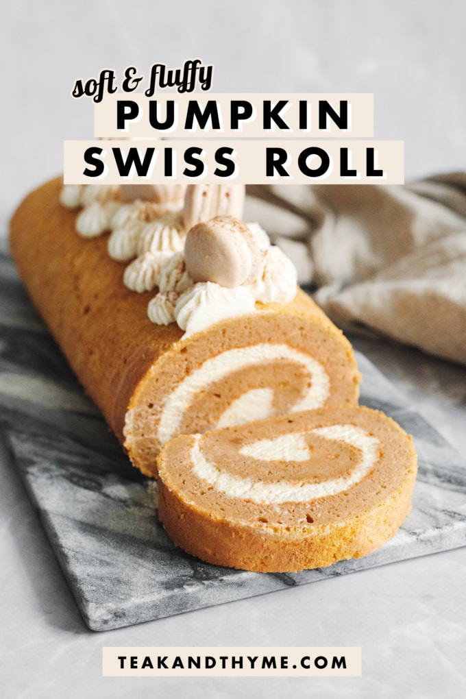 A slice of pumpkin swiss roll cut and laying in front of the roll cake.