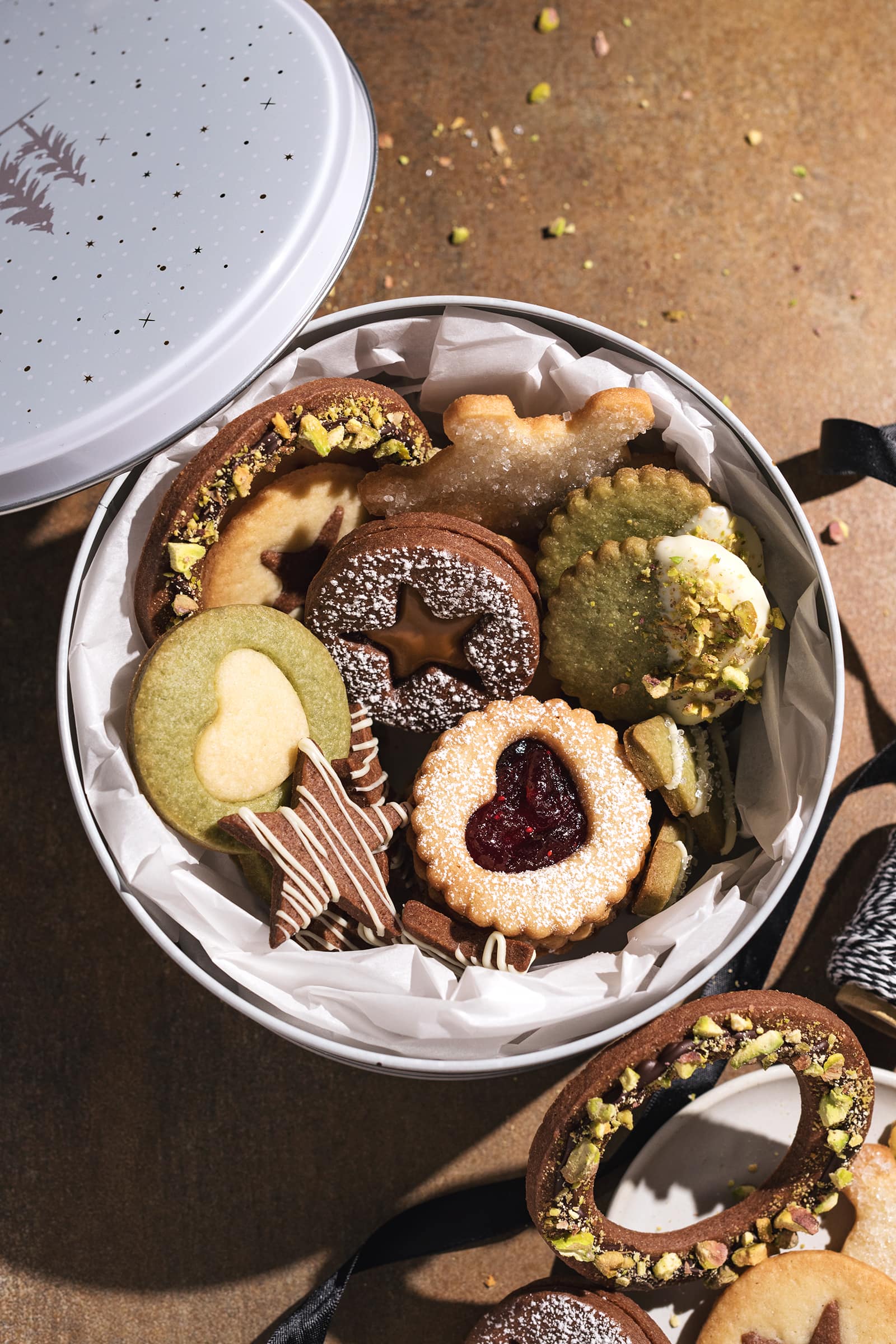 Butter cookie box filled with assorted decorated holiday butter cookies.