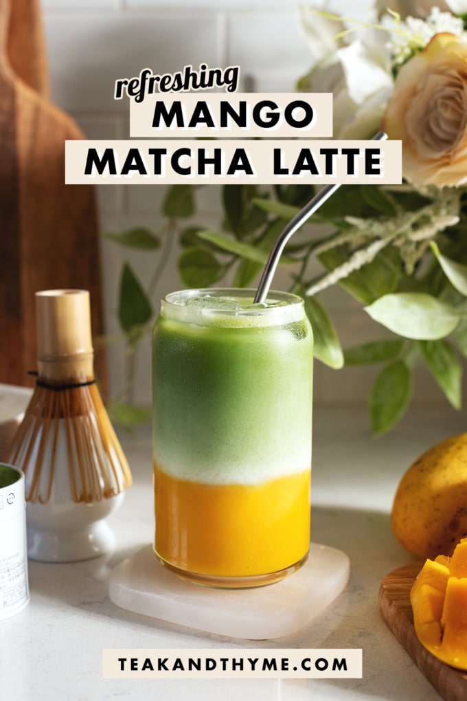 Glass filled with a layer of mango puree on the bottom and matcha on top.