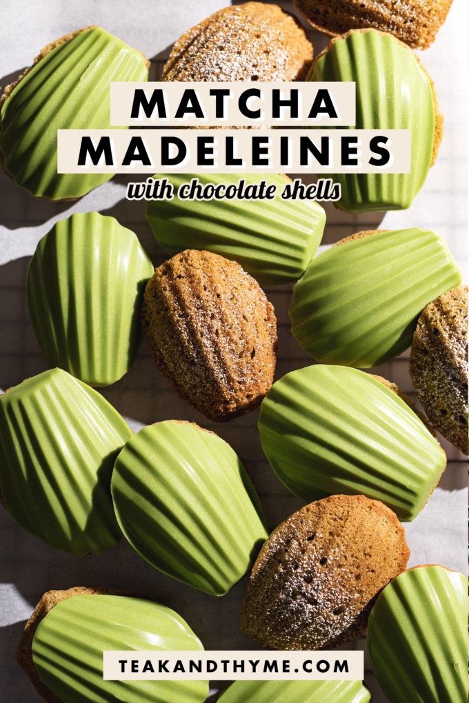 Matcha madeleines scattered on parchment paper, some plain and some with a matcha chocolate shell.