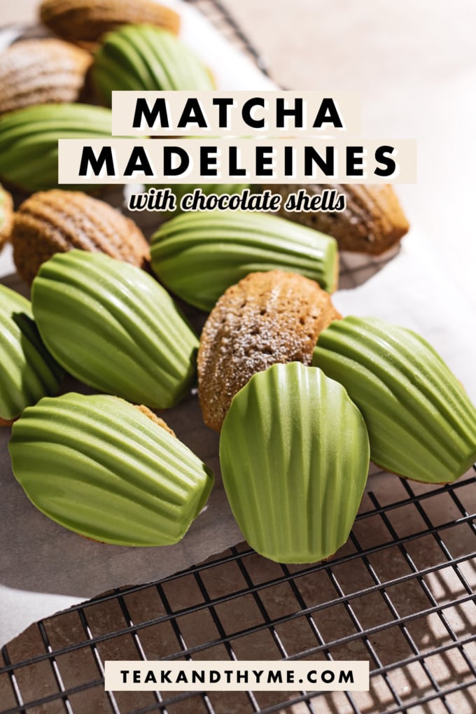 Madeleines covered with a matcha white chocolate shell on a wire rack.