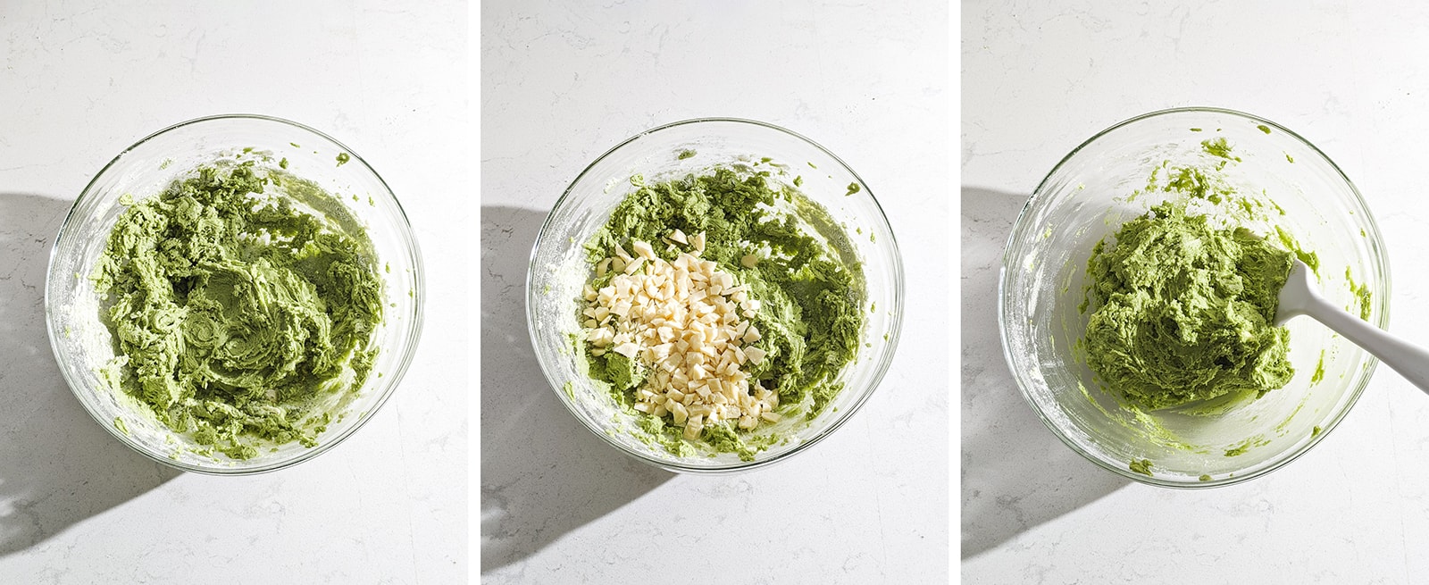 Folding white chocolate chunks into matcha cookie dough.