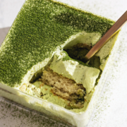 A scoop of matcha tiramisu resting in its container.