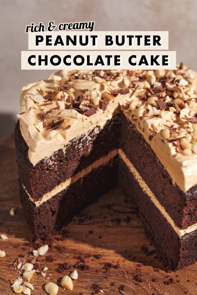 A triangle cut out of a chocolate cake with peanut butter frosting to show its layers.