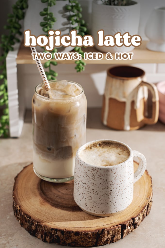 A glass of iced hojicha latte and a mug of hot hojicha latte sitting on wood platter.